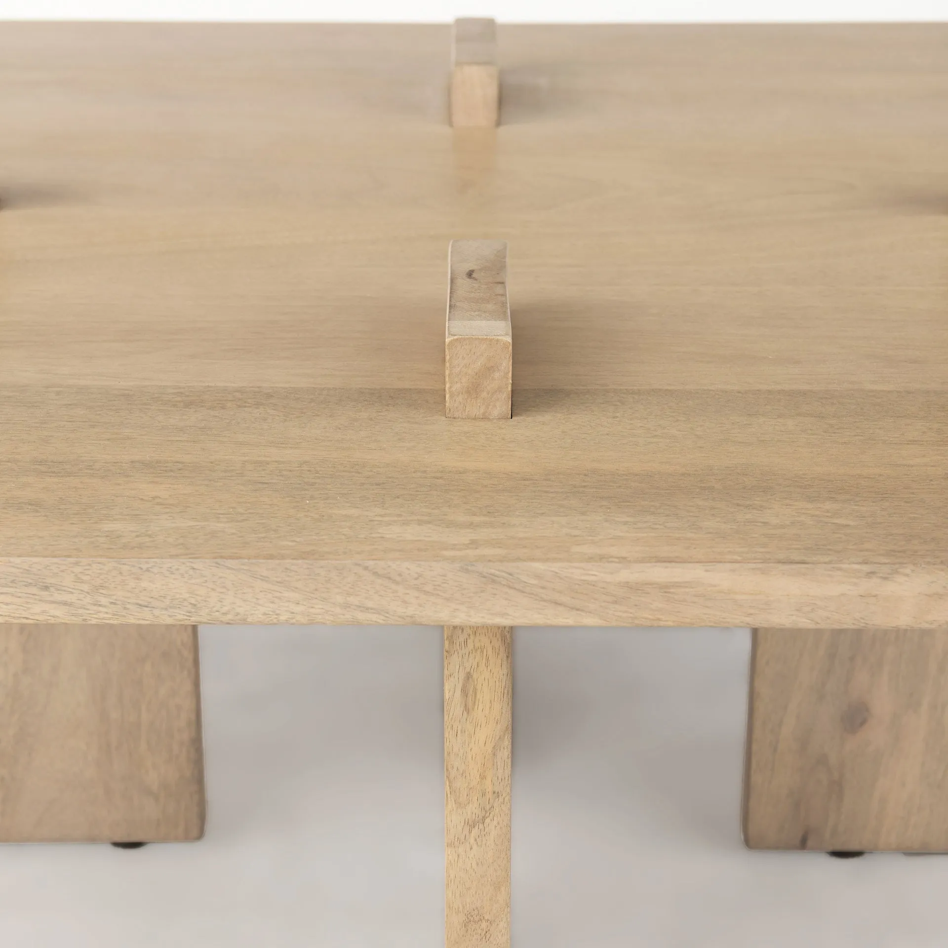 Aida Coffee Table – Contemporary Mango Wood Design with Unique Protruding Legs for Modern Spaces